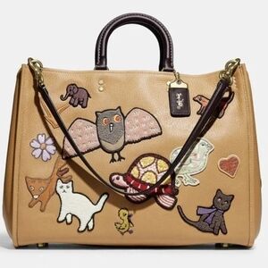 Coach Rogue 39 with Creature Patches (EUC)